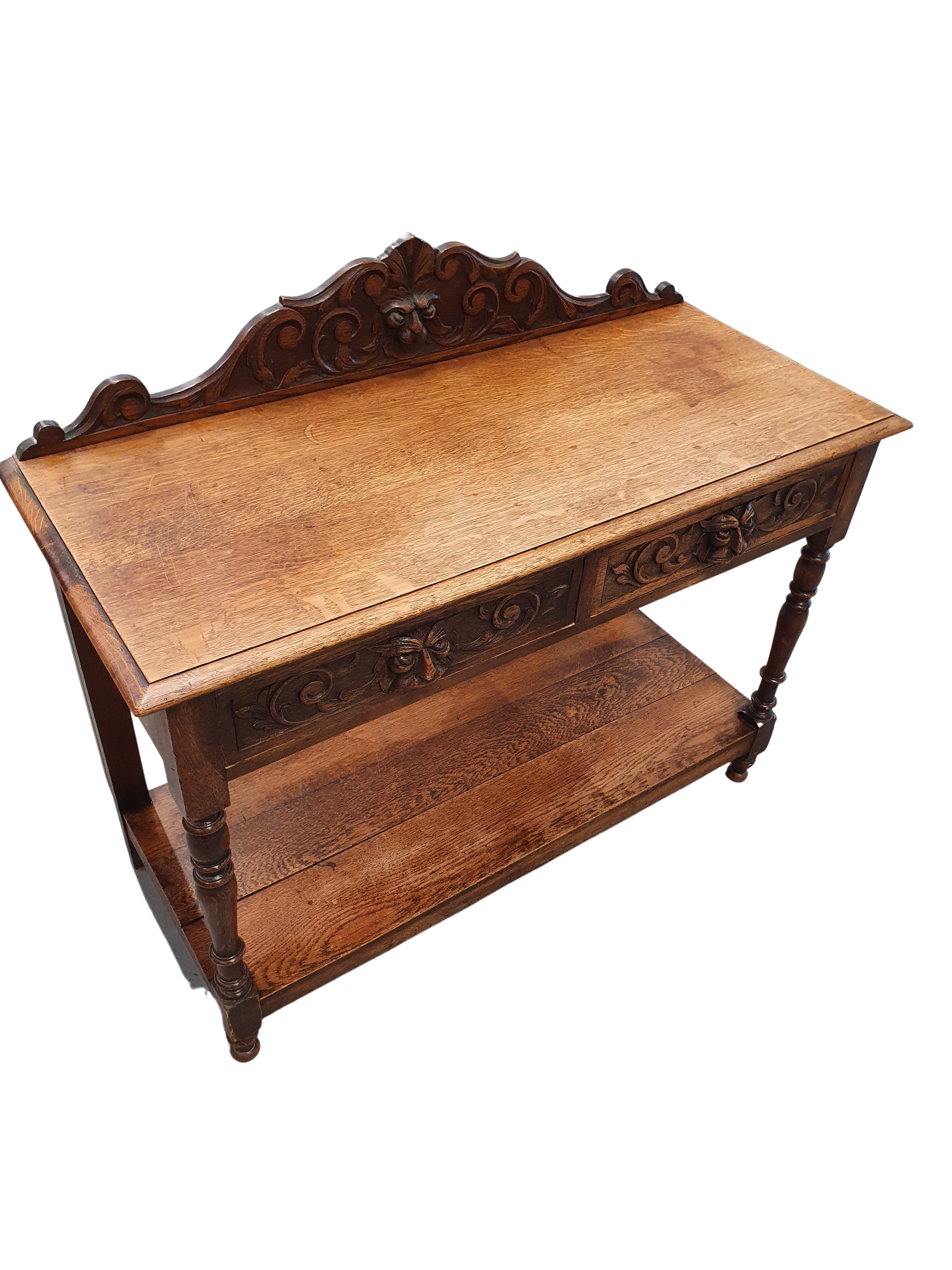 Victorian Gothic Oak side table, decorative carved round 1920. Green Mask decoration
