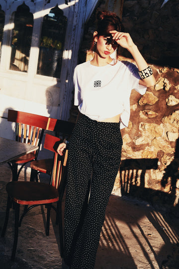 Pantalon noir a petits pois