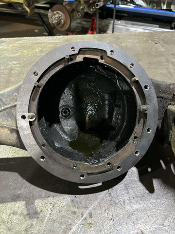 Toyota to Nissan diff centre adaptor ring for 8-inch conversion, showing installation process with Nissan Patrol centre in Toyota housing, highlighting locker and spider gear swap compatibility.