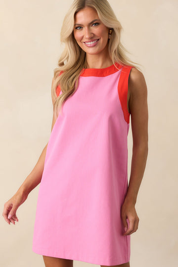 Cropped view focusing on the red contrast trim around the neckline.