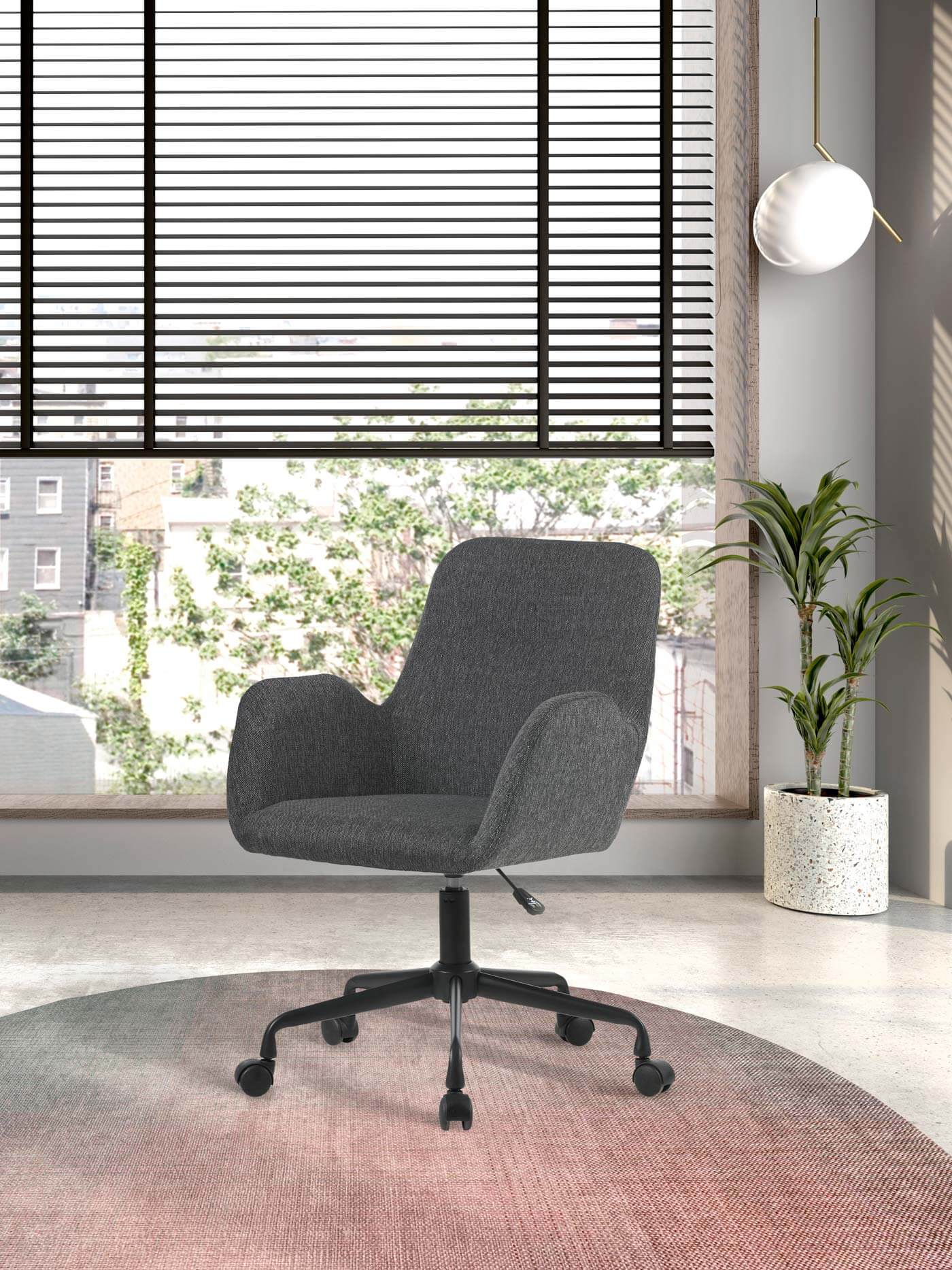 Silla de estudio Herdasa textil gris, diseño ergonómico y giratorio en un entorno moderno.