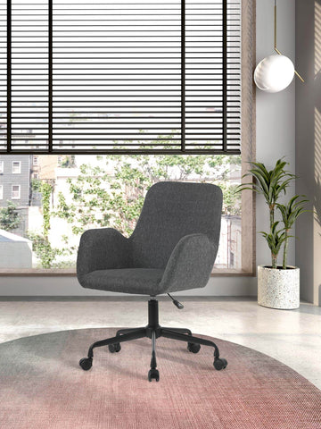 Silla de estudio Herdasa textil gris, diseño ergonómico y giratorio en un entorno moderno.