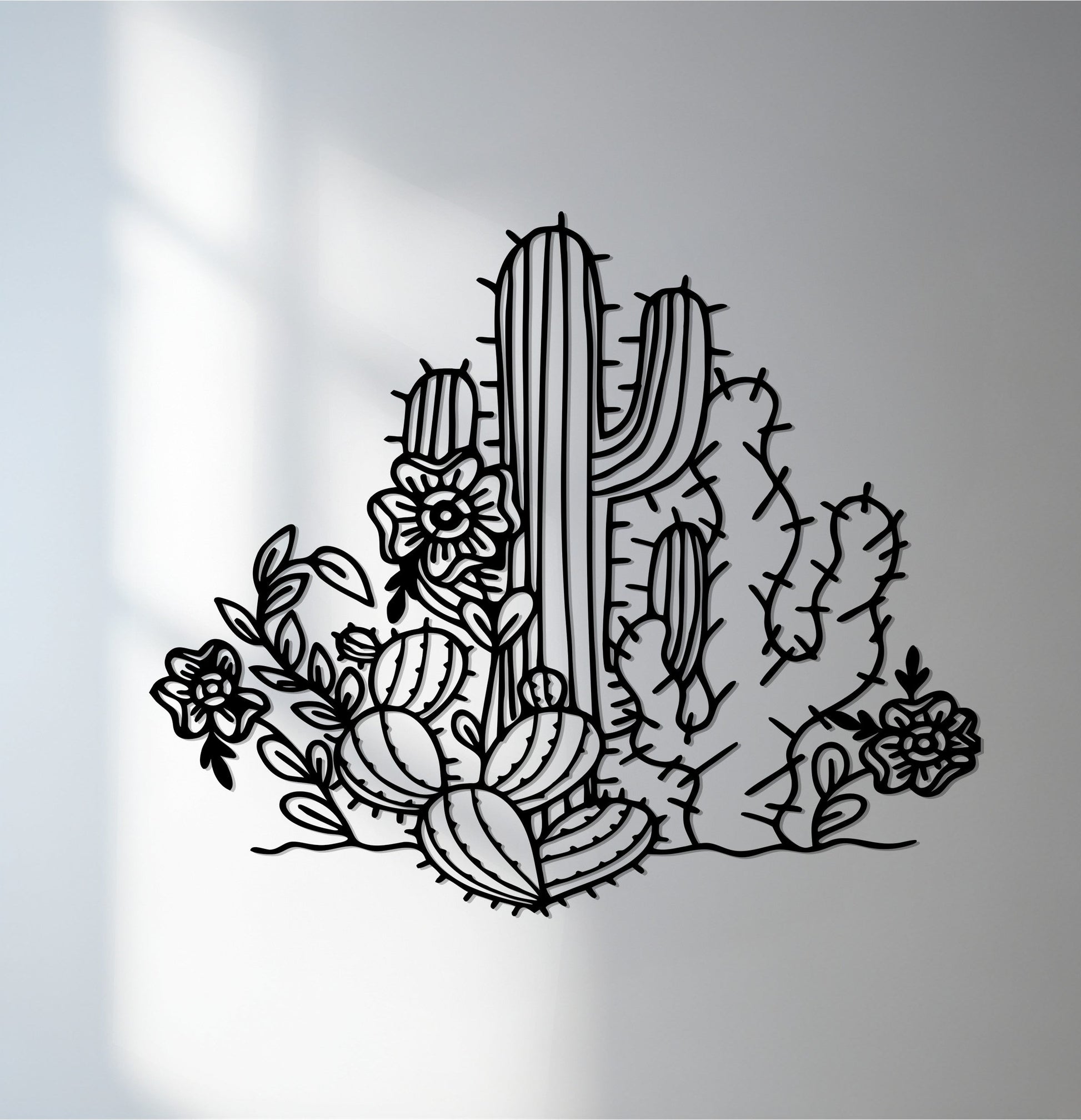 The abstract quality of this desert bloom metal artwork is captured in the flowing lines of the cactus garden design, creating a striking silhouette.