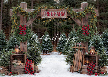 Plaid Wreath Tree Farm photography backdrop with a rustic wooden entrance, plaid wreaths, lanterns, snowy evergreens, pinecones, and winter holiday details for portrait photography.