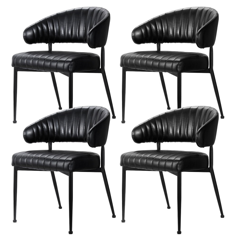 Carey Gully black faux leather hollow armchair dining chairs with metal frame in a dining room