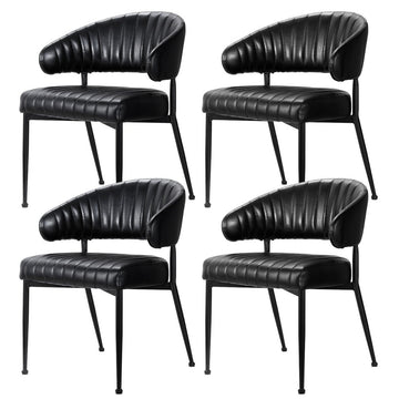 Carey Gully black faux leather hollow armchair dining chairs with metal frame in a dining room