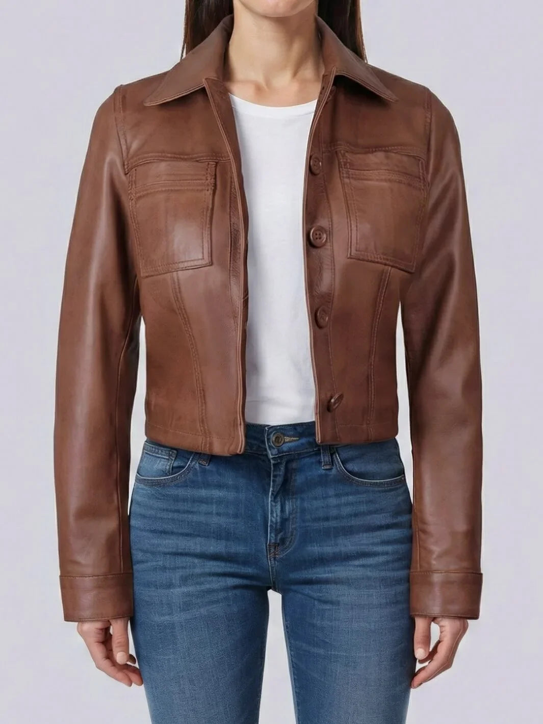 Brown leather jacket worn by a person on a white background