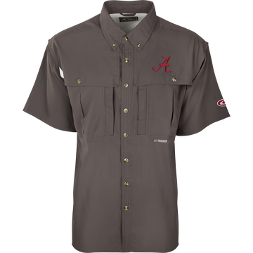 A close-up of the Alabama S/S Flyweight Wingshooter shirt, featuring a logo and red letter. Lightweight and breathable, with moisture-wicking fabric, vented back, and UPF 50+ sun protection. Magnattach™ and zippered pockets included.