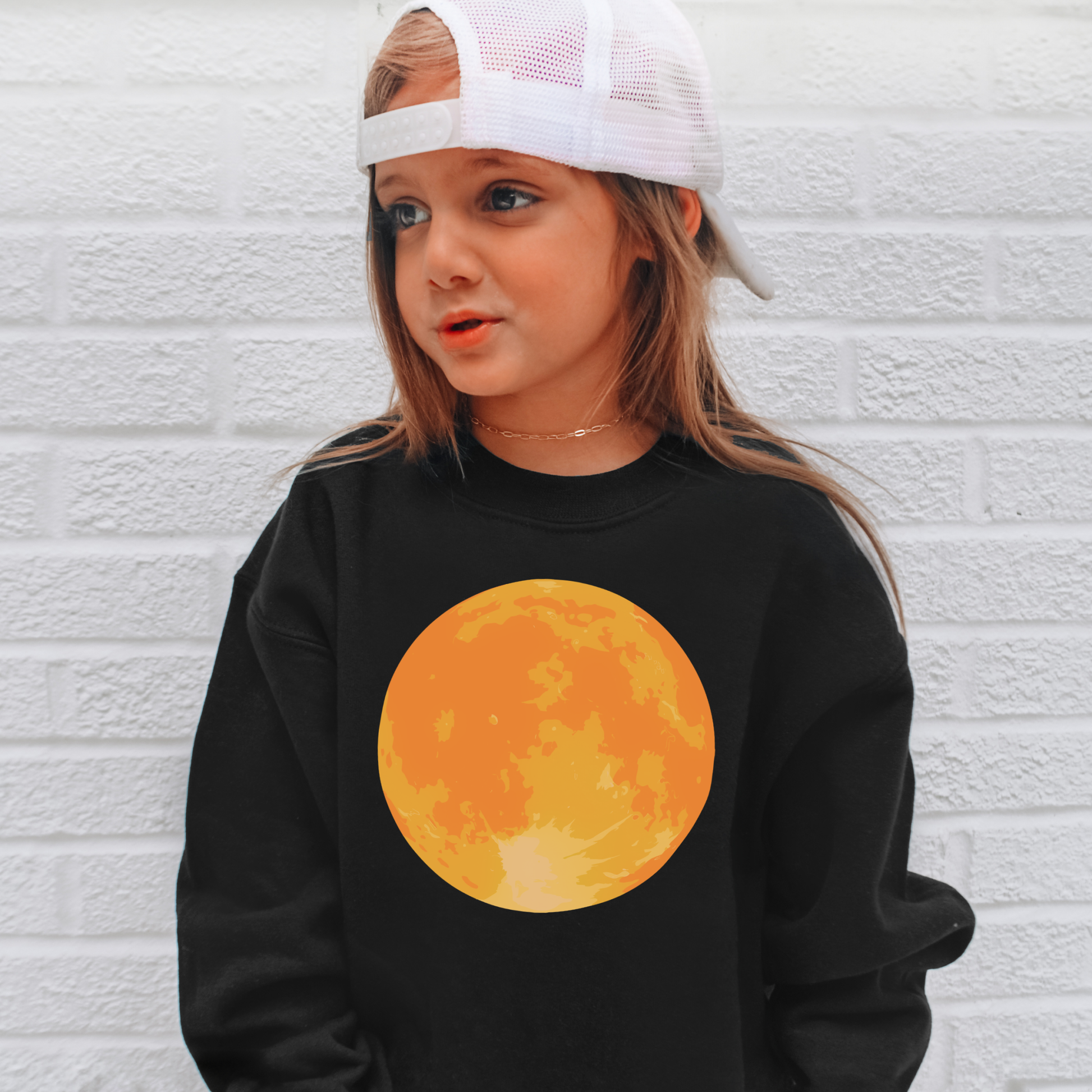 Black kids sweatshirt with vibrant orange full moon graphic on front for halloween toddler and youth pullover