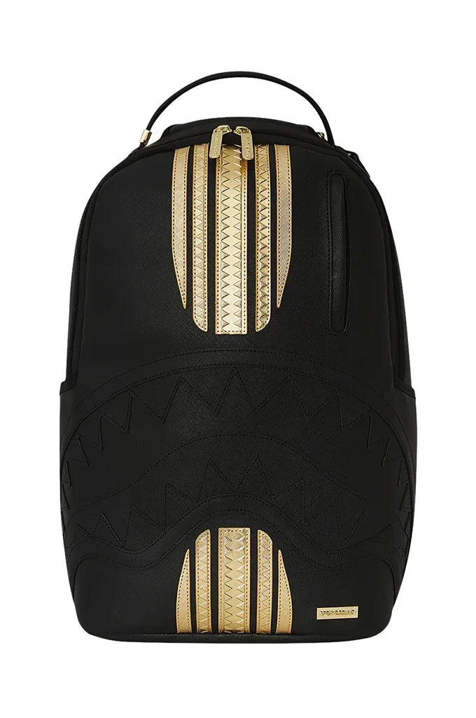 Black and gold shark mouth backpack with textured design, ideal for skateboarding and surfing gear.