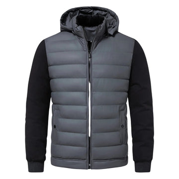 Svart quiltad herrjacka med huva. Trendig och varm vinterjacka för urban stil på kalla dagar.